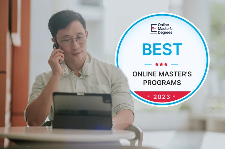 image of a man working remotely with a badge from Online Master's Degrees reading best online master's programs 2023